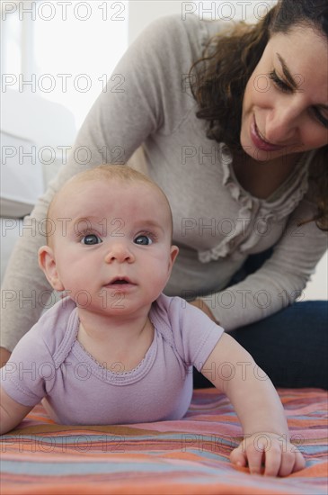 Mother and baby boy (2-5 months) posing together. Photo : Jamie Grill