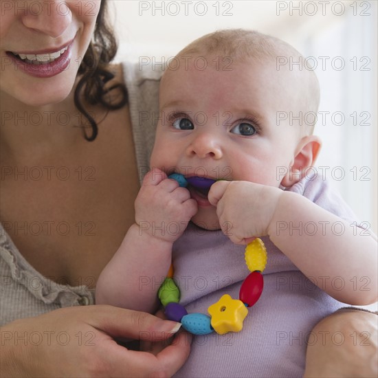 Mother and baby boy (2-5 months) playing together . Photo: Jamie Grill