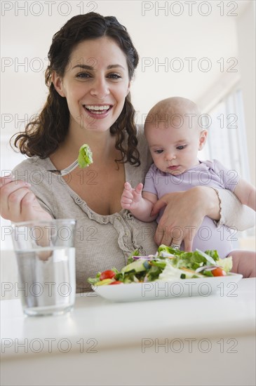 Mother and baby boy (2-5 months) eating salad. Photo: Jamie Grill