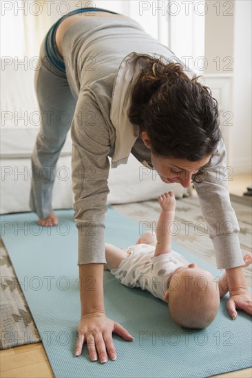 Mother and baby boy (2-5 months) exercising together. Photo: Jamie Grill