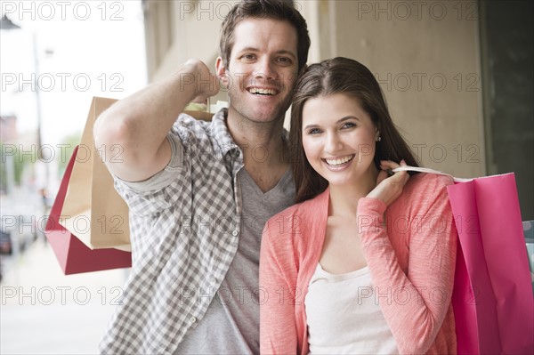 USA, New Jersey, Jersey City, Happy young couple shopping. Photo : Jamie Grill