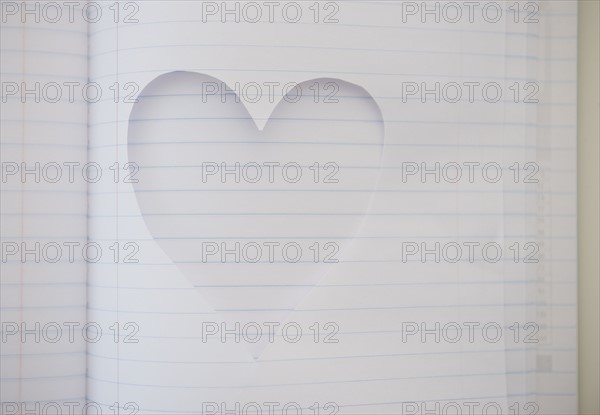 Heart shape cut out of note book. Photo: Jamie Grill