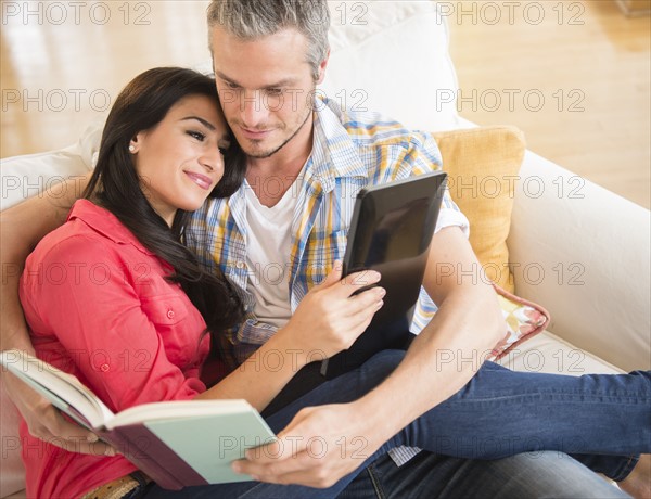 Couple relaxing on sofa. Photo: Jamie Grill