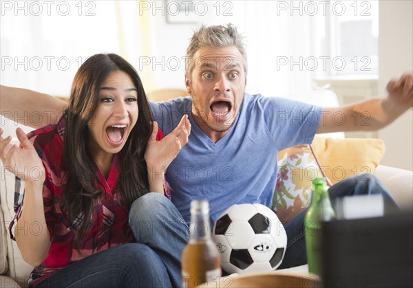 Couple watching tv. Photo : Jamie Grill