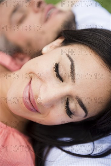 Couple lying together. Photo : Jamie Grill