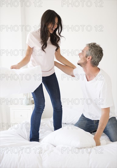 Couple having pillow fight. Photo : Jamie Grill