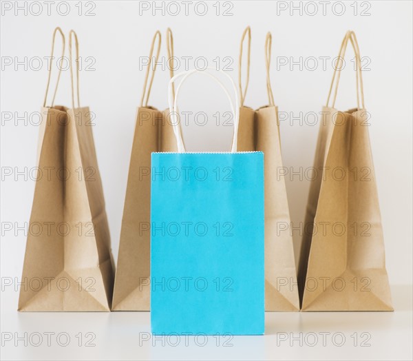 Studio shot of shopping bags and note book. Photo: Daniel Grill