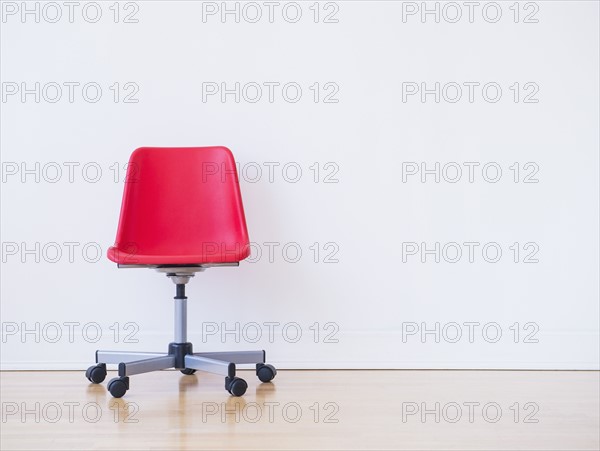 Studio shot of red office chair. Photo: Daniel Grill