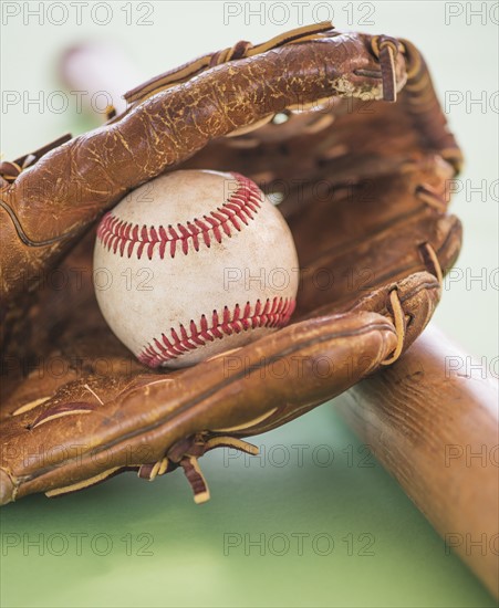 Baseball glove with ball and bat. Photo: Daniel Grill