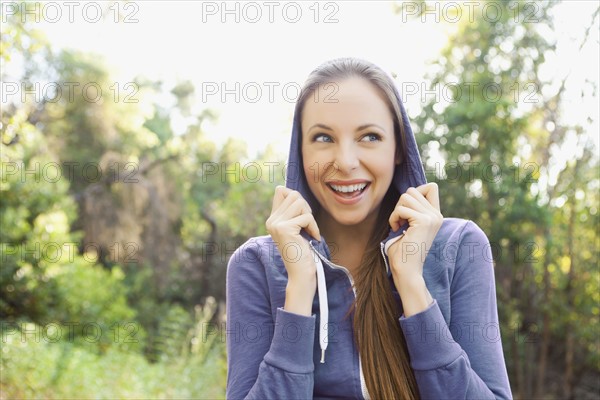 Portrait of laughing woman in tracksuit. Photo : Sarah M. Golonka