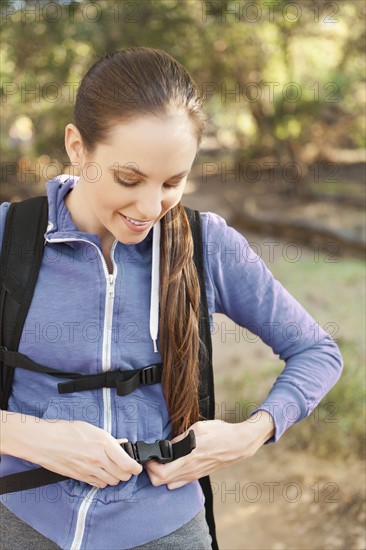 Woman adjusting backpack. Photo: Sarah M. Golonka