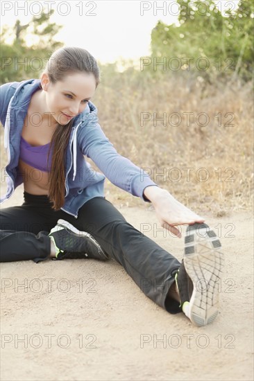 Woman exercising on dusty track. Photo: Sarah M. Golonka