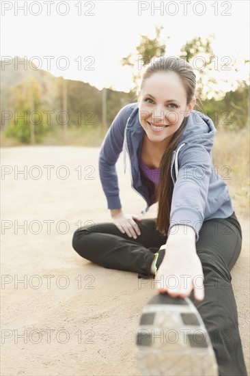 Woman exercising on dusty track. Photo: Sarah M. Golonka