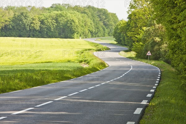 France, Rocroi, Road among green fields. Photo: Mike Kemp