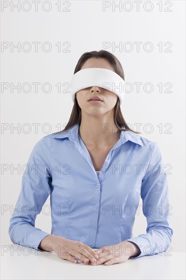 Studio shot of woman wearing blindfold. Photo: Jan Scherders