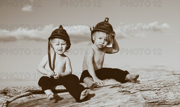 Portrait of two boys (2-3) wearing hats. Photo : King Lawrence