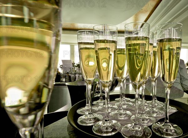 Chapmagne flutes on tray in restaurant. Photo: DKAR Images