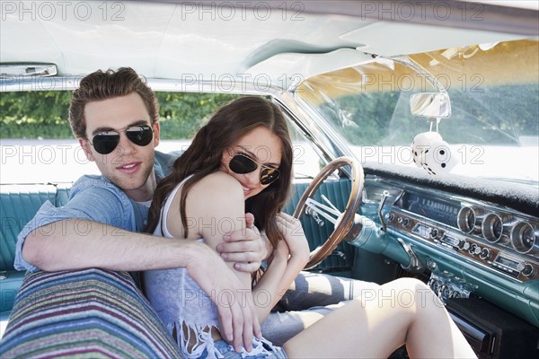 Couple in vintage car. Photo : Mark de Leeuw