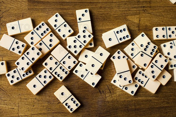 Domino tiles on wooden surface, studio shot. Photo: Jessica Peterson