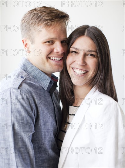 Portrait of young couple, studio shot. Photo : Jessica Peterson