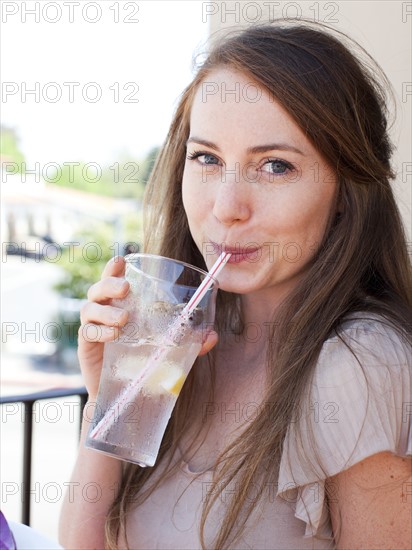 Portrait of young woman drinking water. Photo: Jessica Peterson