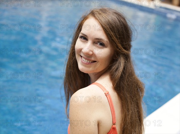 Portrait of young woman at swimming pool. Photo: Jessica Peterson