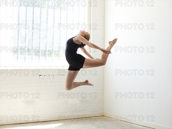 Teenage (16-17) gymnast exercising. Photo: Jessica Peterson