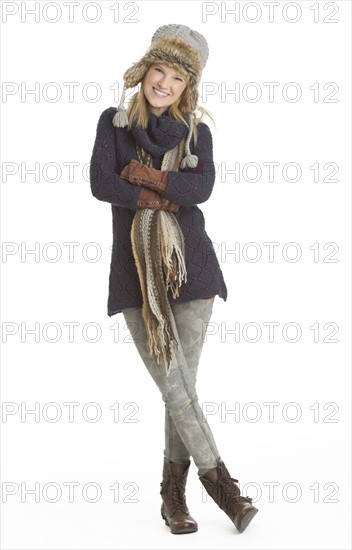 Portrait of woman smiling, studio shot.