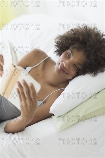 Woman reading in bed.