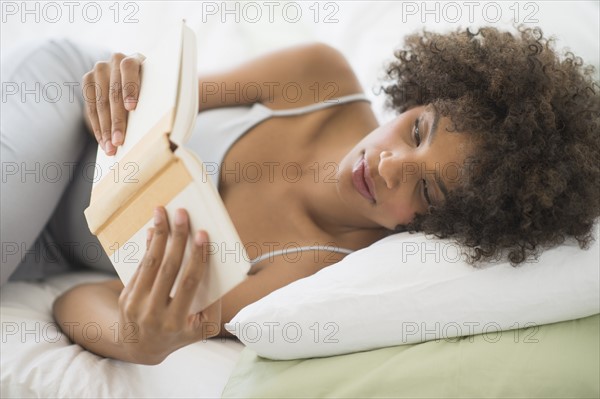 Woman reading in bed.