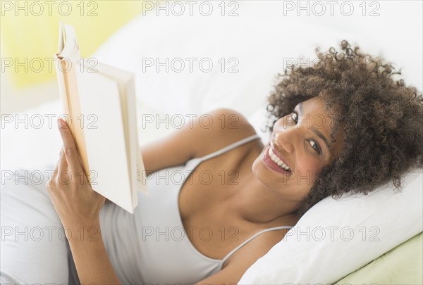 Woman reading in bed.