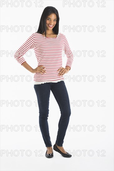 Portrait of woman smiling, studio shot.