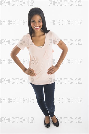 Portrait of woman smiling, studio shot.