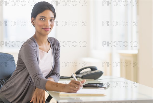 Portrait of businesswoman in office.