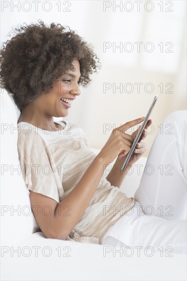 Woman using digital tablet.