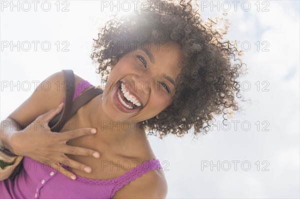 Portrait of woman laughing.