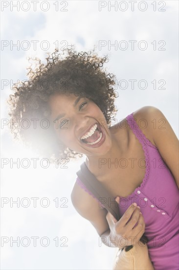 Portrait of woman laughing.