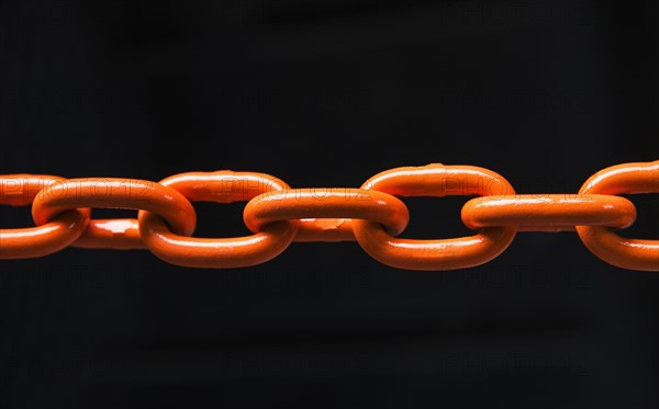 Chain on black background, studio shot.