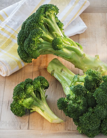 Broccoli on cutting board, studio shot.