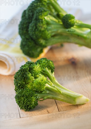 Broccoli on cutting board, studio shot.