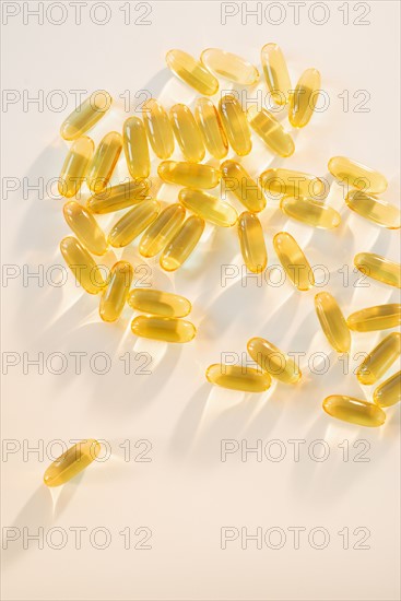 Omega fatty acid pills on white background, studio shot.