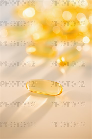 Omega fatty acid pills on white background, studio shot.