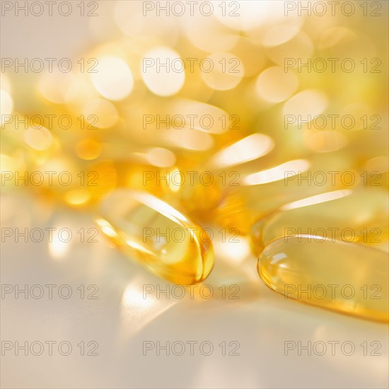 Omega fatty acid pills on white background, studio shot.