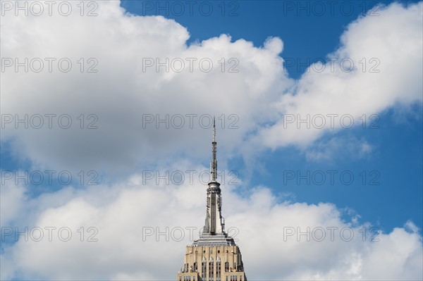 Empire State Building under blue sky.