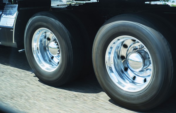 Wheels of truck in motion.