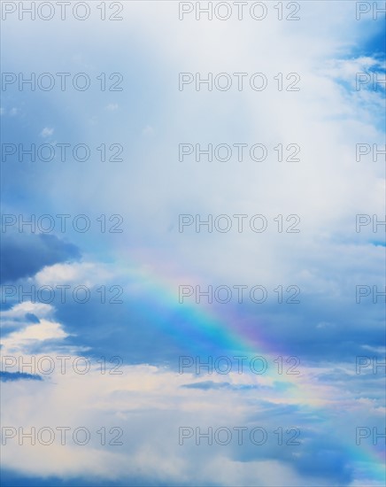 Rainbow in clouds.