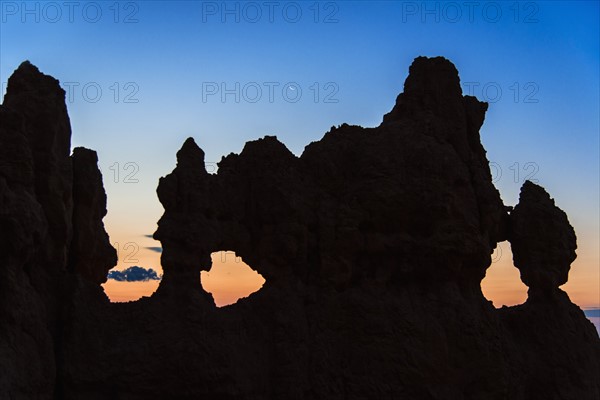 Silhouette of rock at dusk.