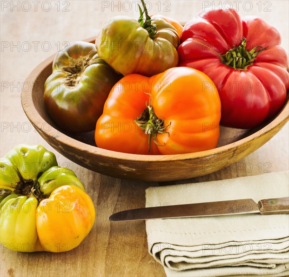 Heirloom tomatoes on kitchen table.