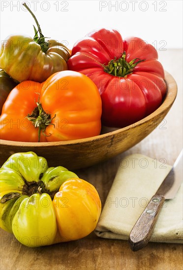 Heirloom tomatoes on kitchen table.