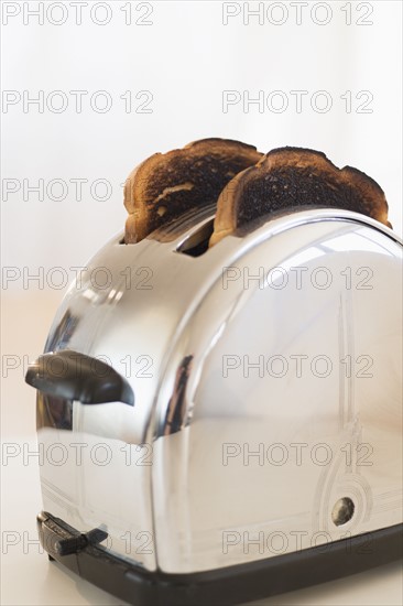 Burnt toasts in toaster.